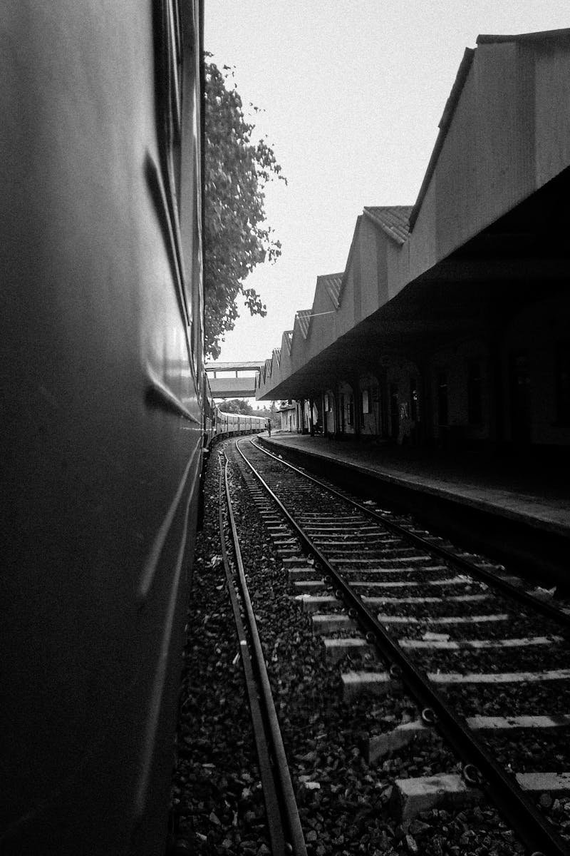 Black and white view of a train track and platform in Moratuwa, Sri Lanka.